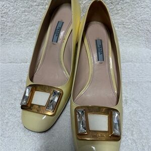 Prada Women's Cream Patent Leather Loafers with Gold Accents